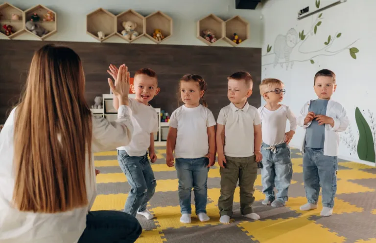 Happy toddlers engaged in a creative group activity at our quality learning center, developing social and cognitive skills in a bright, supportive environment.