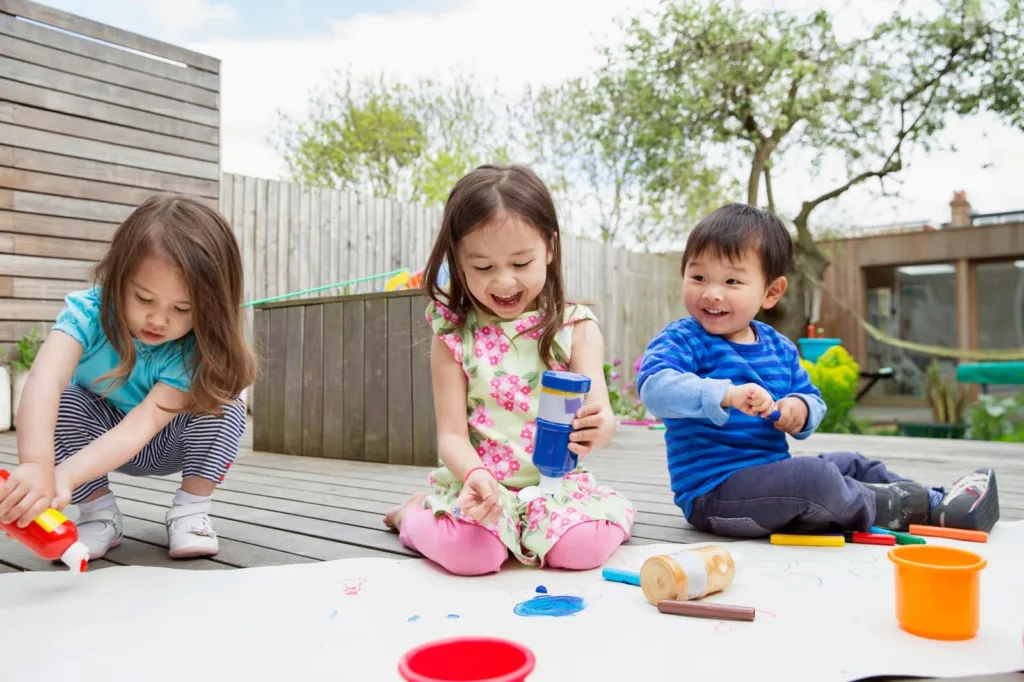 A comprehensive informational graphic detailing early learning programs at a premium preschool south surrey facility, showcasing age-specific infant, toddler, and pre-K curricula alongside core pillars of play-based learning, certified staff, and kindergarten readiness pathways by Surrey City Childcare.